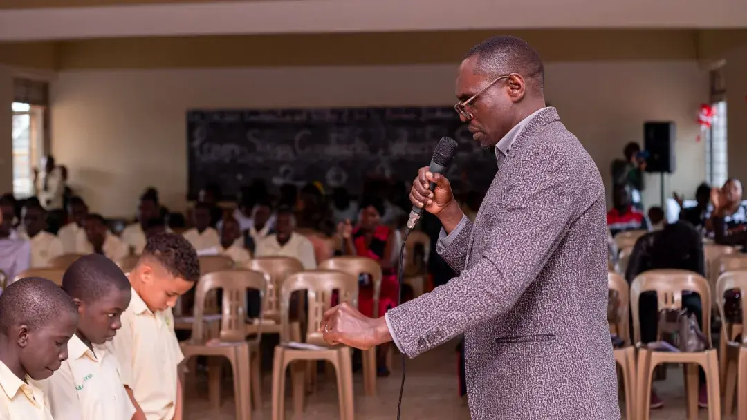Parent praying for candidates