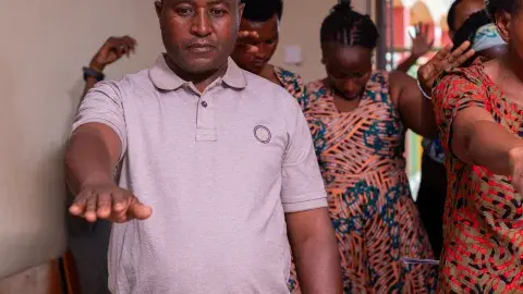 Parent praying for candidates