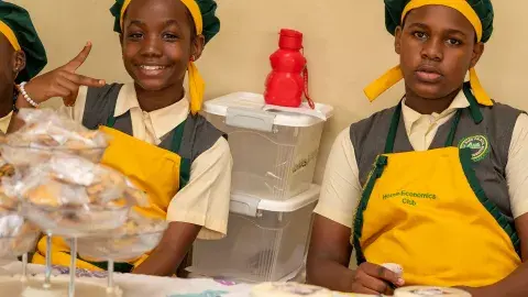 Kloe and Michelle selling cakes and eshabwe