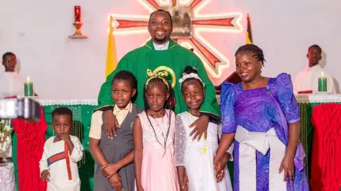 Family picture with priest