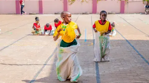 Sack race and button fixing